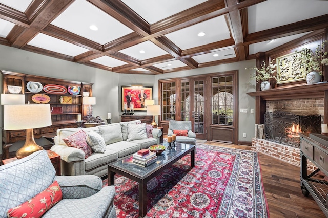 living room featuring wood finished floors, coffered ceiling, a fireplace, beamed ceiling, and recessed lighting