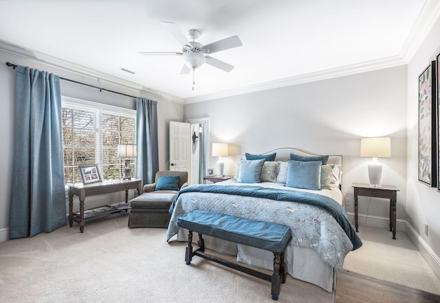 bedroom featuring crown molding, carpet flooring, baseboards, and a ceiling fan