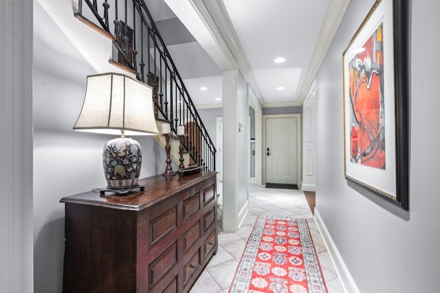 hallway with inlaid floor details, stairs, recessed lighting, ornamental molding, and baseboards