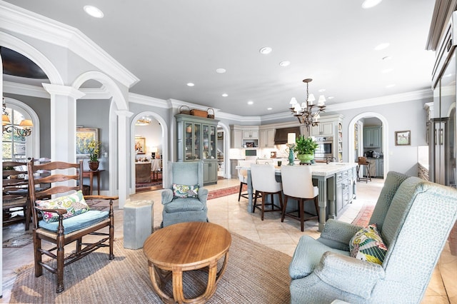 living area with a chandelier, arched walkways, crown molding, recessed lighting, and light tile patterned flooring