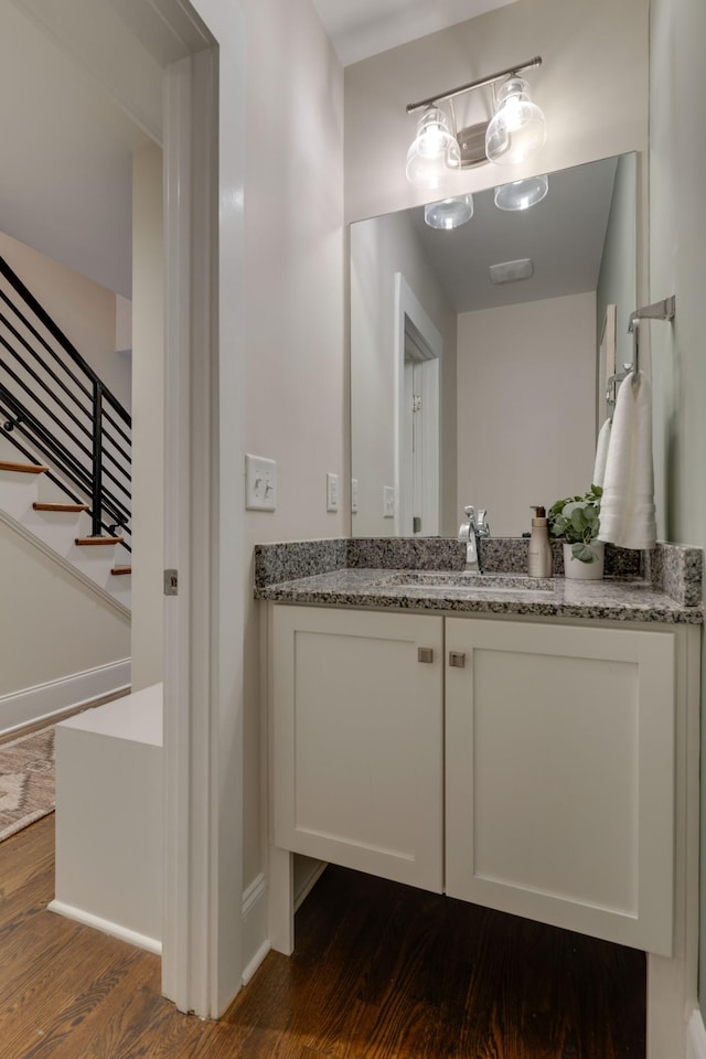 bathroom featuring wood finished floors and vanity