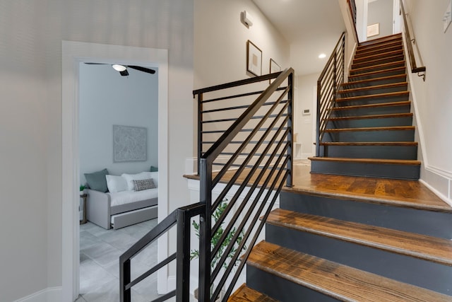 stairs featuring baseboards and recessed lighting