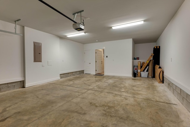 garage featuring electric panel and a garage door opener