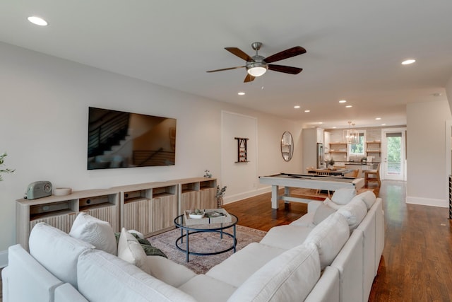 living area featuring a ceiling fan, recessed lighting, baseboards, and wood finished floors