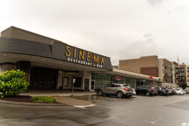 view of commercial property featuring uncovered parking