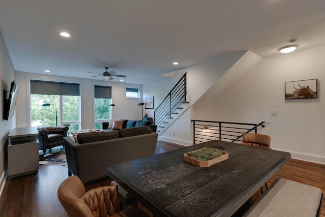 dining room featuring a ceiling fan, baseboards, dark wood finished floors, recessed lighting, and stairway