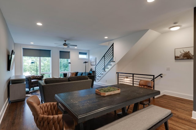 dining room with baseboards, ceiling fan, wood finished floors, stairs, and recessed lighting