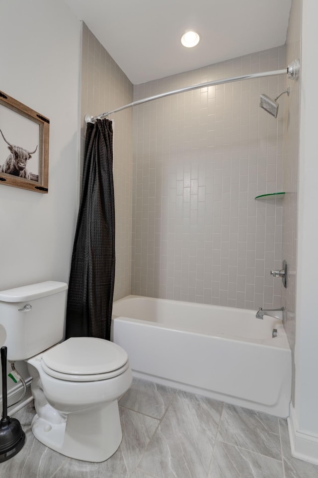 full bath with shower / tub combo and toilet