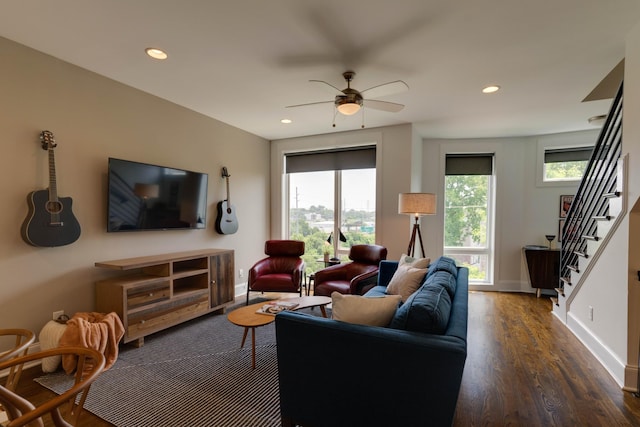 living room featuring wood finished floors, stairway, baseboards, ceiling fan, and recessed lighting