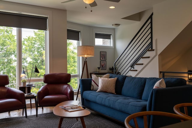 living room with ceiling fan, stairs, and recessed lighting