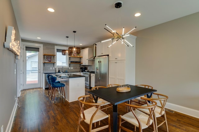 dining area with baseboards, dark wood-type flooring, and recessed lighting