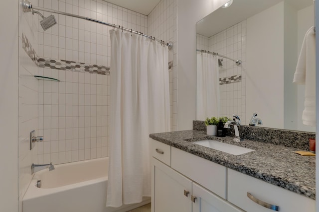 bathroom featuring shower / bath combination with curtain and vanity