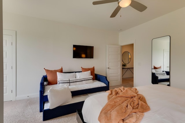 carpeted bedroom with a ceiling fan and baseboards