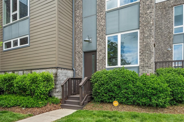 entrance to property with brick siding