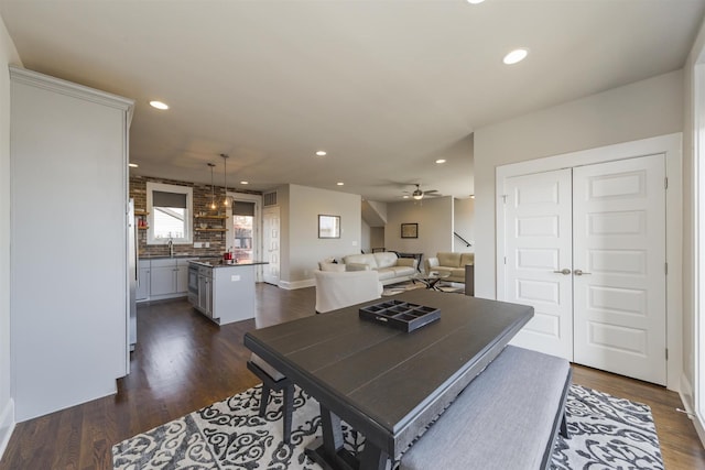 dining room featuring recessed lighting, dark wood finished floors, and ceiling fan