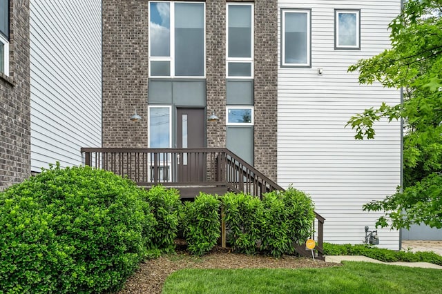 property entrance with a deck