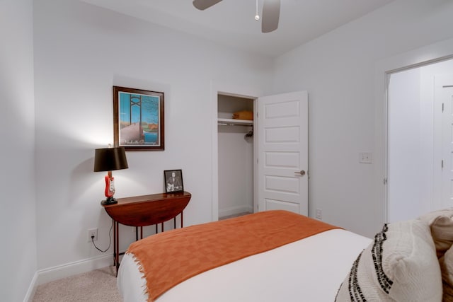 bedroom with baseboards, carpet flooring, a closet, and a ceiling fan