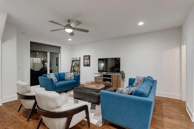 living area with ceiling fan, wood finished floors, baseboards, and recessed lighting