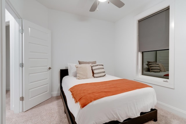 bedroom with carpet floors, baseboards, and a ceiling fan