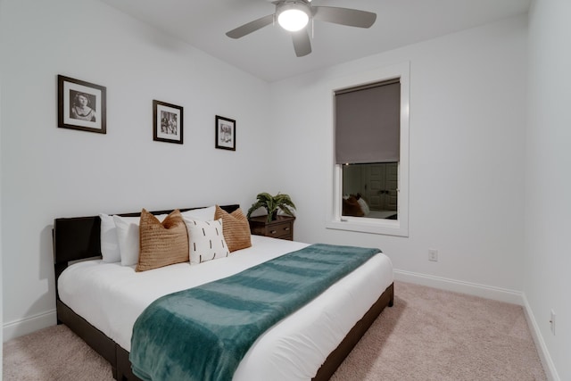 carpeted bedroom with baseboards and ceiling fan