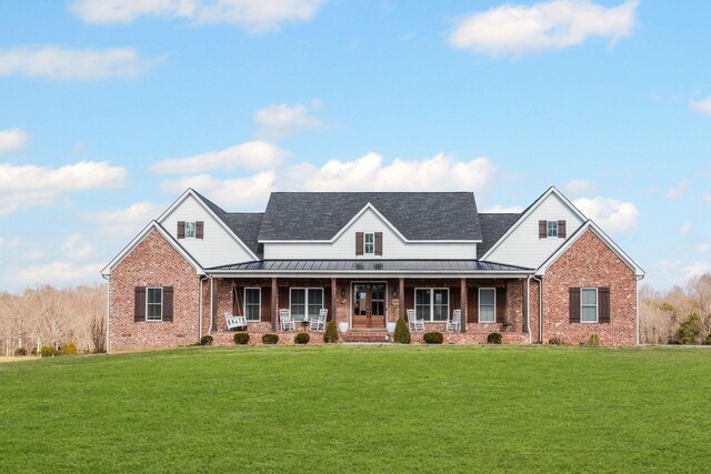 7480 Horn Tavern Rd, Fairview, TN 37062 - view of front of property with brick siding, a front lawn, and a porch