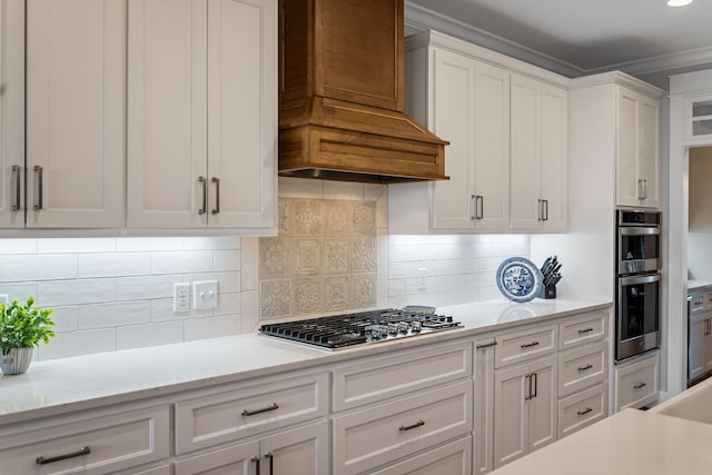 7480 Horn Tavern Rd, Fairview, TN 37062 - kitchen featuring custom exhaust hood, white cabinetry, appliances with stainless steel finishes, decorative backsplash, and crown molding