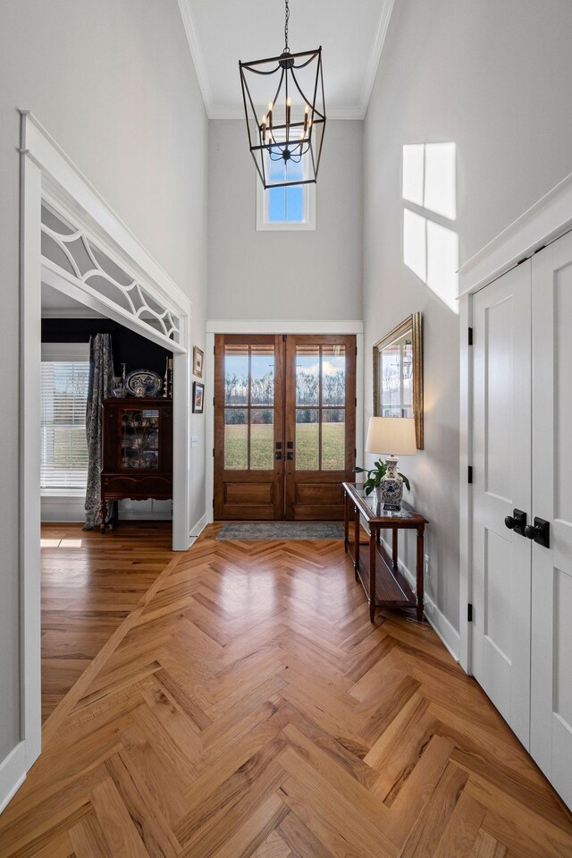 7480 Horn Tavern Rd, Fairview, TN 37062 - entrance foyer featuring a high ceiling, crown molding, french doors, a chandelier, and baseboards