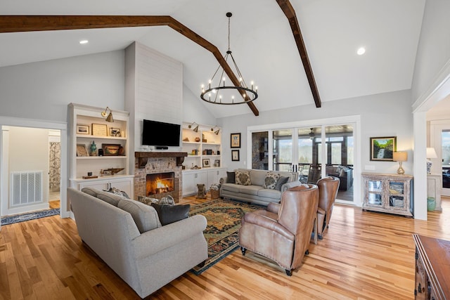7480 Horn Tavern Rd, Fairview, TN 37062 - living area featuring high vaulted ceiling, a chandelier, a fireplace, light wood-style flooring, and beamed ceiling