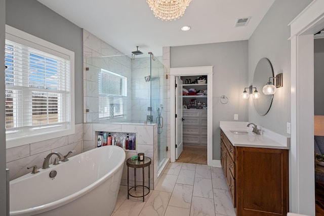 7480 Horn Tavern Rd, Fairview, TN 37062 - bathroom with marble finish flooring, a stall shower, a soaking tub, vanity, and a walk in closet