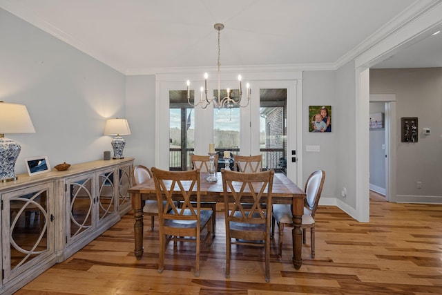 7480 Horn Tavern Rd, Fairview, TN 37062 - dining space featuring a chandelier, light wood-style floors, baseboards, and ornamental molding