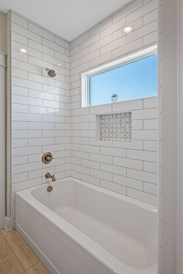7480 Horn Tavern Rd, Fairview, TN 37062 - bathroom featuring wood finished floors, shower / bathtub combination, and healthy amount of natural light
