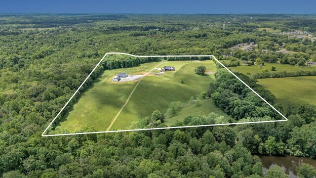 7480 Horn Tavern Rd, Fairview, TN 37062 - view of rural area featuring a heavily wooded area and property parcel outlined