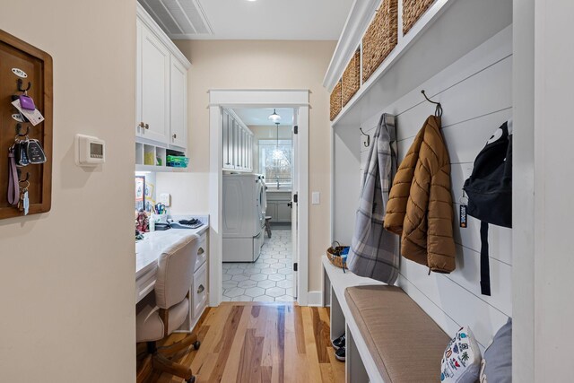 7480 Horn Tavern Rd, Fairview, TN 37062 - mudroom featuring washer / dryer and light wood-type flooring
