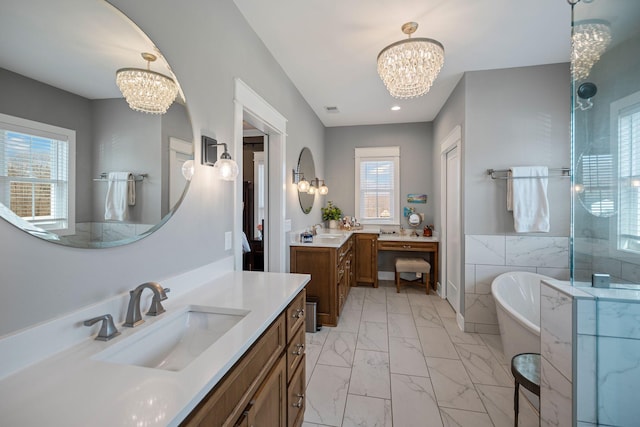 7480 Horn Tavern Rd, Fairview, TN 37062 - full bath featuring a chandelier, marble look tiles, a soaking tub, a walk in shower, and recessed lighting