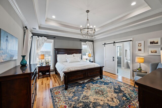 7480 Horn Tavern Rd, Fairview, TN 37062 - bedroom featuring a barn door, a tray ceiling, a chandelier, light wood-style floors, and ornamental molding