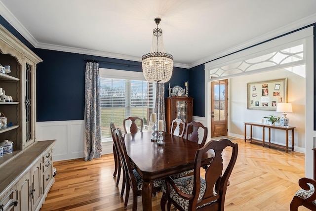 7480 Horn Tavern Rd, Fairview, TN 37062 - dining room featuring a chandelier, wainscoting, and ornamental molding