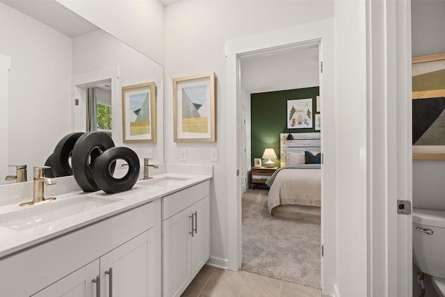 ensuite bathroom with toilet and double vanity