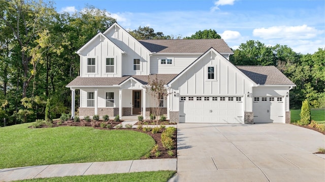 modern inspired farmhouse featuring board and batten siding, concrete driveway, a porch, and a front yard