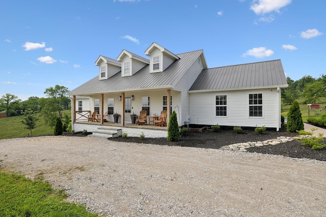 4588 Roy Thompson Rd, Mount Pleasant, TN 38474 - cape cod house featuring metal roof, covered porch, and dirt driveway