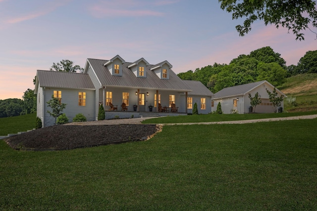 4588 Roy Thompson Rd, Mount Pleasant, TN 38474 - modern inspired farmhouse with covered porch, a front yard, metal roof, and a detached garage