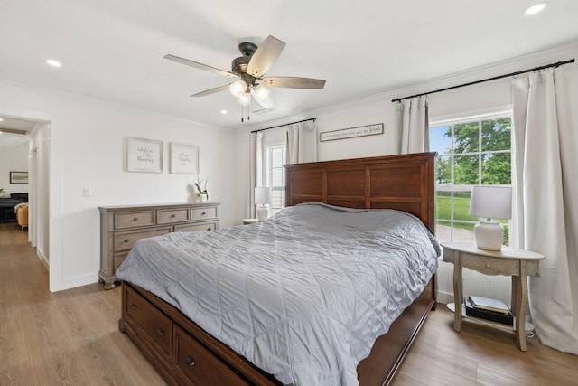 4588 Roy Thompson Rd, Mount Pleasant, TN 38474 - bedroom with multiple windows, ornamental molding, light wood finished floors, recessed lighting, and baseboards