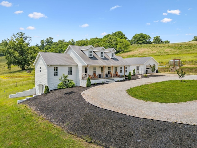 4588 Roy Thompson Rd, Mount Pleasant, TN 38474 - new england style home with driveway, covered porch, a garage, and a front lawn