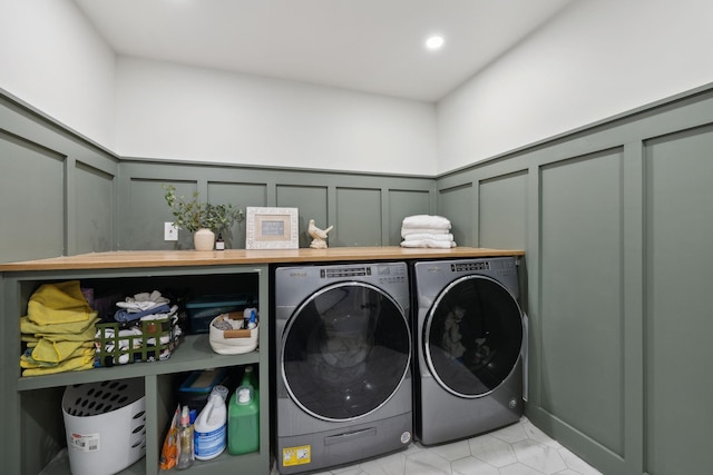 4588 Roy Thompson Rd, Mount Pleasant, TN 38474 - laundry area featuring a decorative wall, washer and dryer, and a wainscoted wall