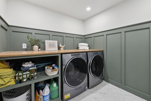 4588 Roy Thompson Rd, Mount Pleasant, TN 38474 - laundry area with a decorative wall, washer and dryer, wainscoting, light tile patterned floors, and recessed lighting