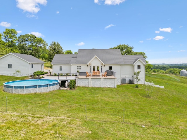 4588 Roy Thompson Rd, Mount Pleasant, TN 38474 - rear view of house with an outdoor pool, metal roof, and central AC
