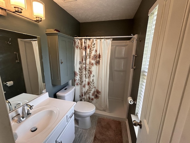 7324 Bermuda Dr, Christiana, TN 37037 - bathroom with toilet, a textured ceiling, vanity, curtained shower, and wood finished floors
