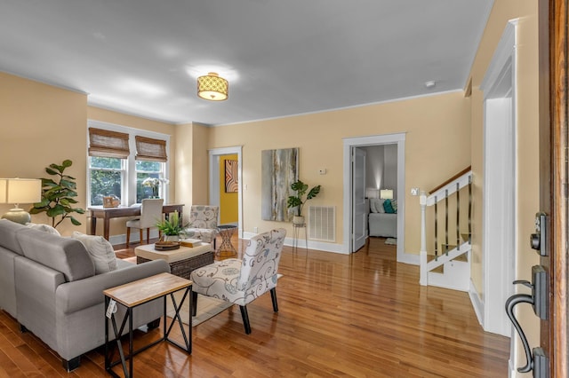 2642 Stuart St, Burns, TN 37029 - living area with wood finished floors, stairway, and baseboards