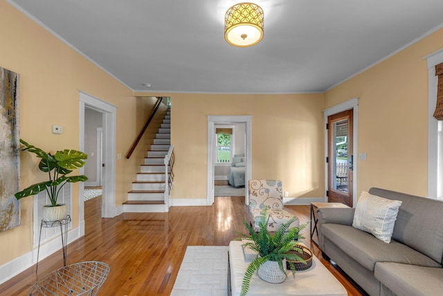 2642 Stuart St, Burns, TN 37029 - living room with ornamental molding, stairs, baseboards, and wood-type flooring