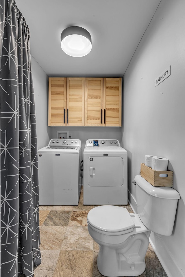 2642 Stuart St, Burns, TN 37029 - bathroom with separate washer and dryer, stone finish flooring, toilet, and baseboards