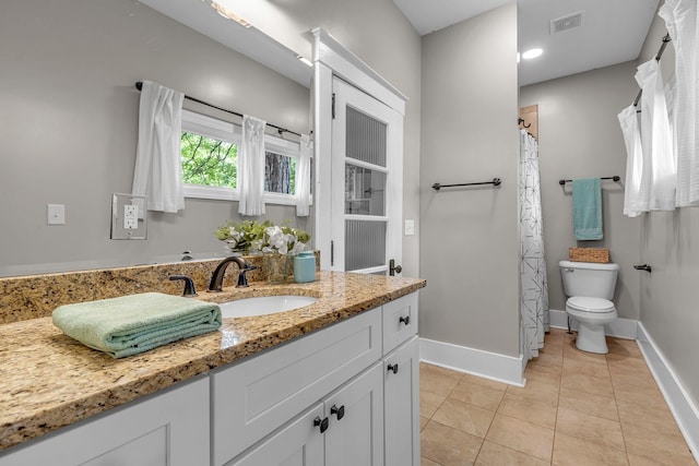 2642 Stuart St, Burns, TN 37029 - bathroom with toilet, vanity, tile patterned floors, and baseboards